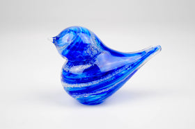 blue glass bird with cremation ash from pets and people