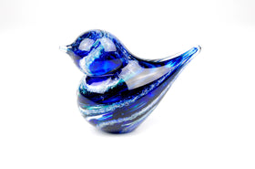 blue glass bird with cremation ash from pets and people