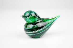 green glass bird with cremation ash from pets and people