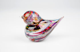 dark multicolor glass bird with cremation ash from pets and people