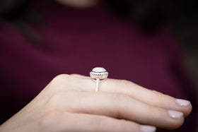 cremation ring on hand with ash from pets and people side view