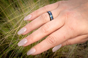 ceramic ring with cremation ash on hand