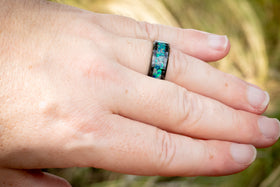 ceramic ring with cremation ash on hand