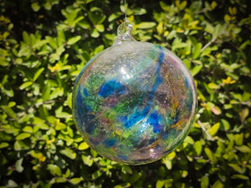 glass Christmas ornament with ash